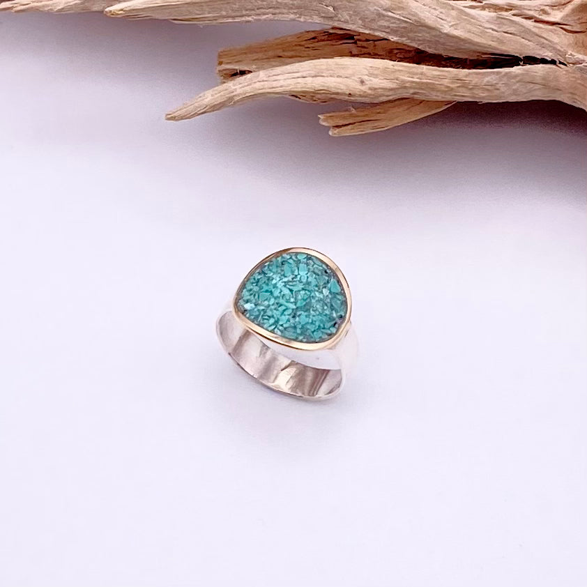 This modern clean line sterling silver ring holds a golden halo encircling a beautiful layer of inlayed turquoise. Made to order! Please allow extra time. 